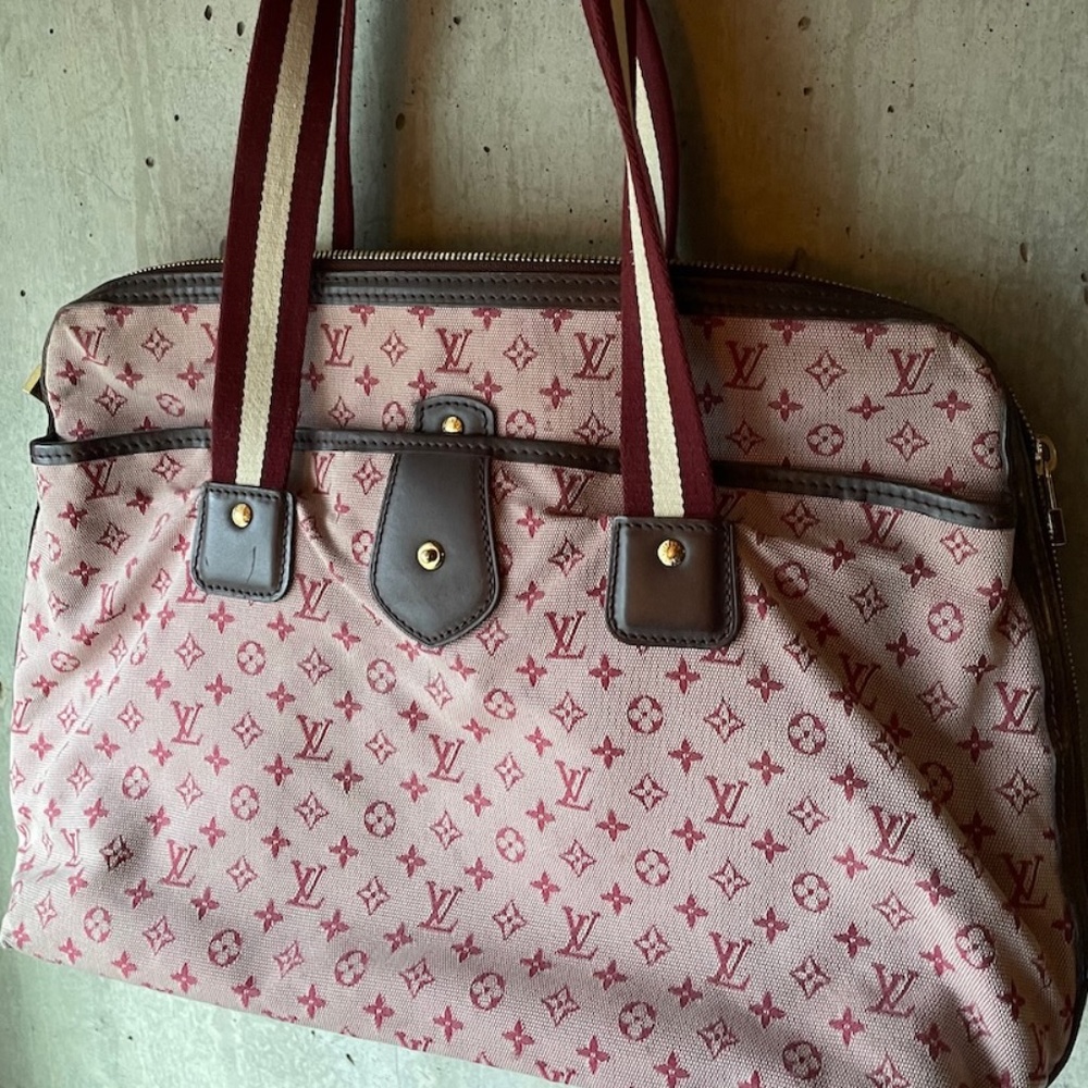 Louis Vuitton bag with red logos